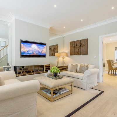A living room filled with furniture and a fireplace